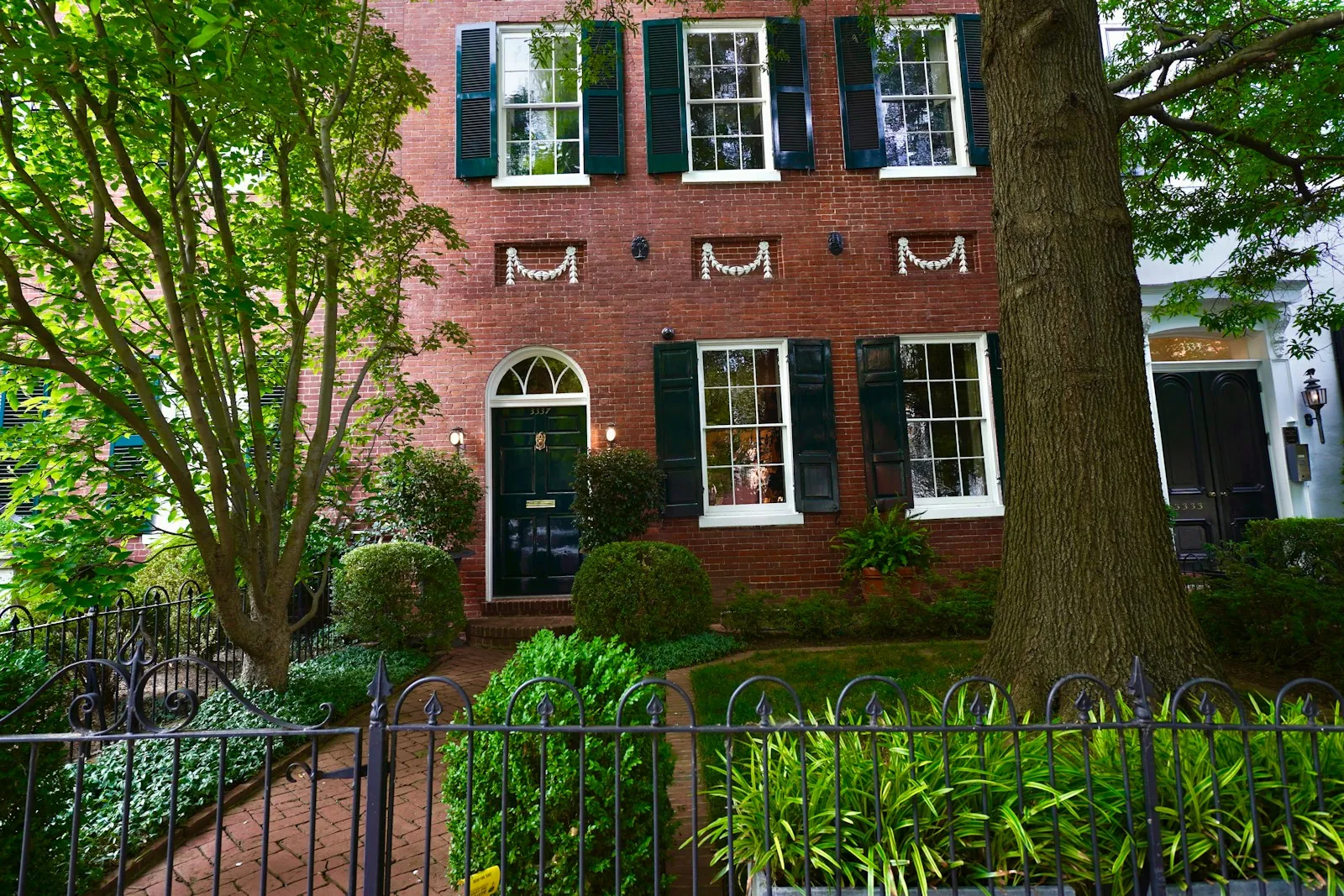 Charming residential Indianapolis IN home showcasing rain gutters and downspouts along the roofline